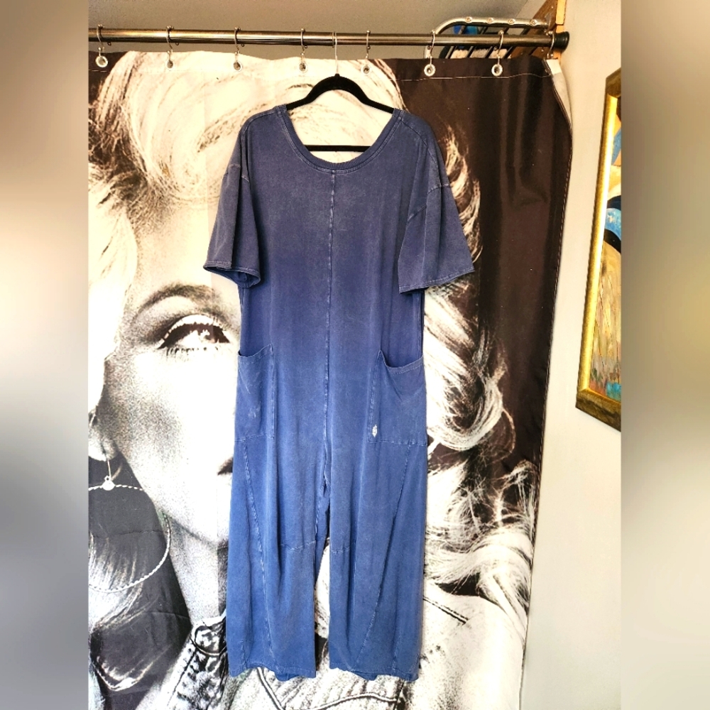 Free People navy blue one piece.  NWOT.  Oversized. Fits up to large/xl